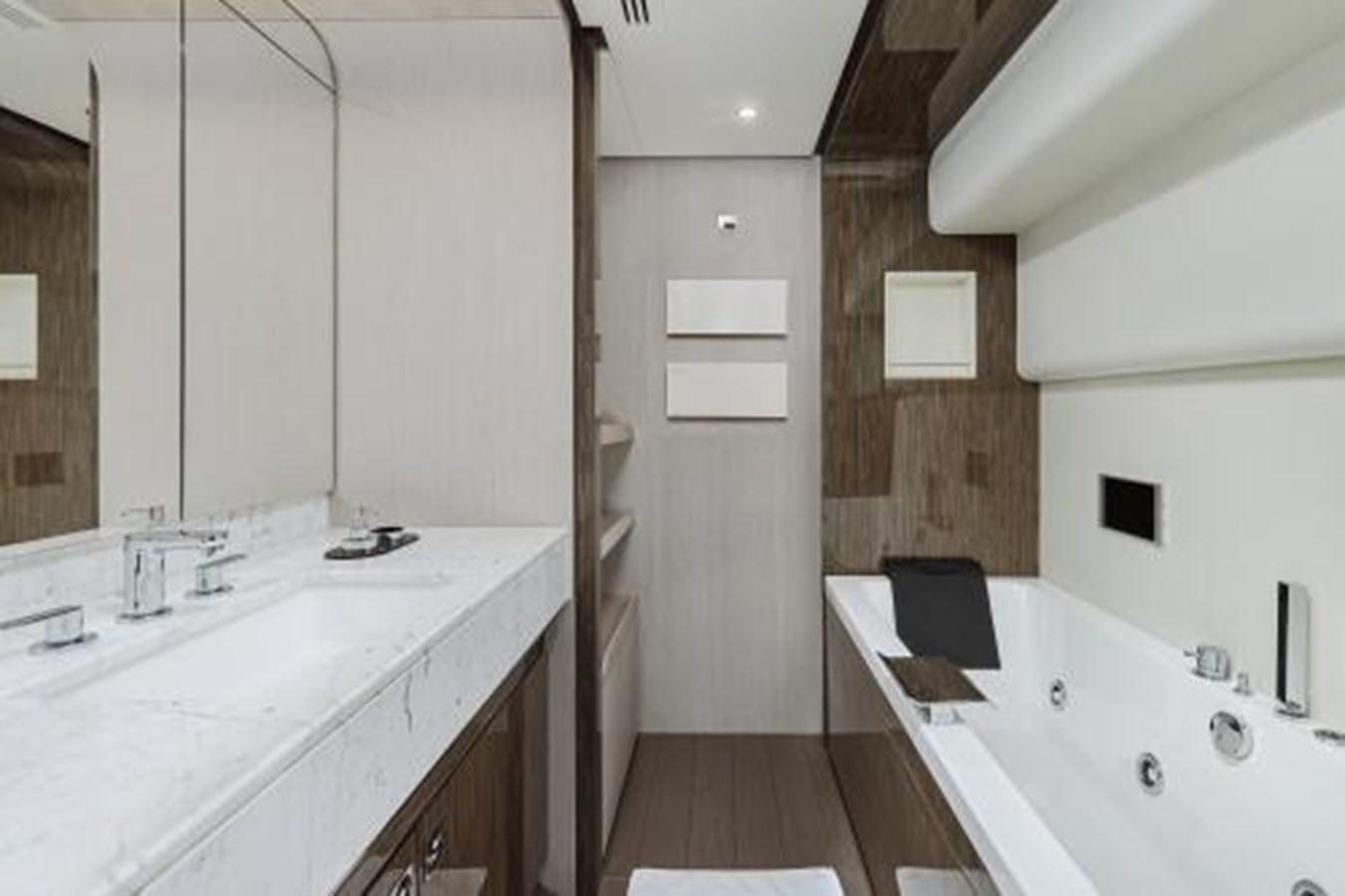 a bathroom with a sink and a bathtub aboard SILVIA Yacht for Sale