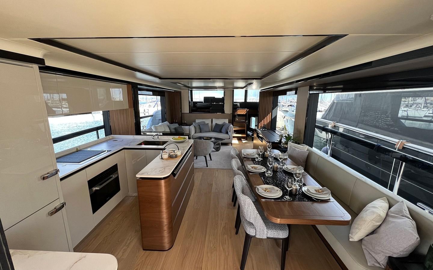 a room with a table and chairs aboard A4A Yacht for Sale