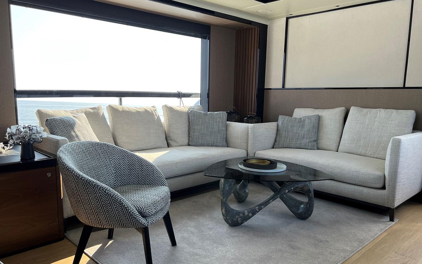 a living room with a couch and a coffee table aboard A4A Yacht for Sale