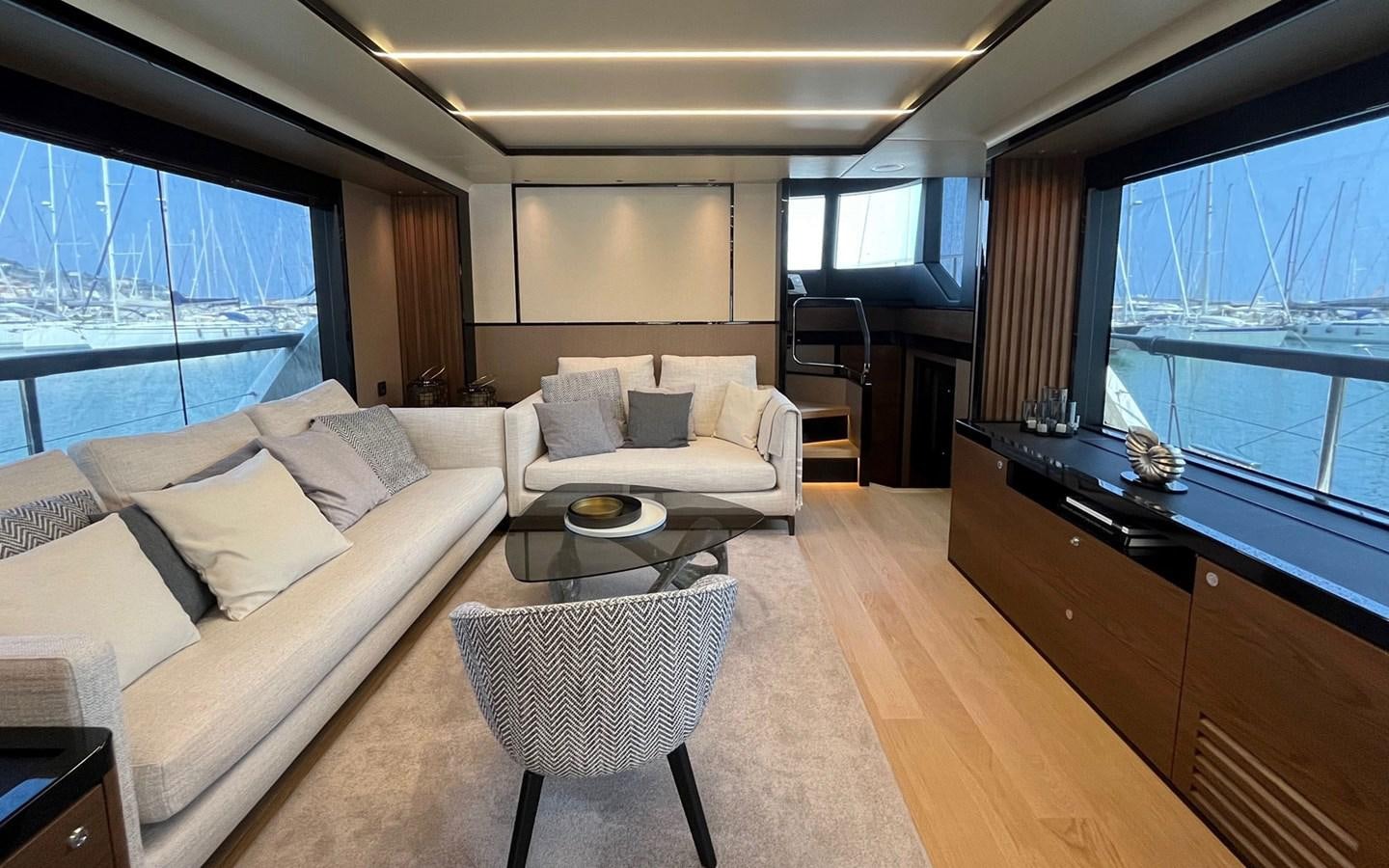 a living room with a large window aboard A4A Yacht for Sale