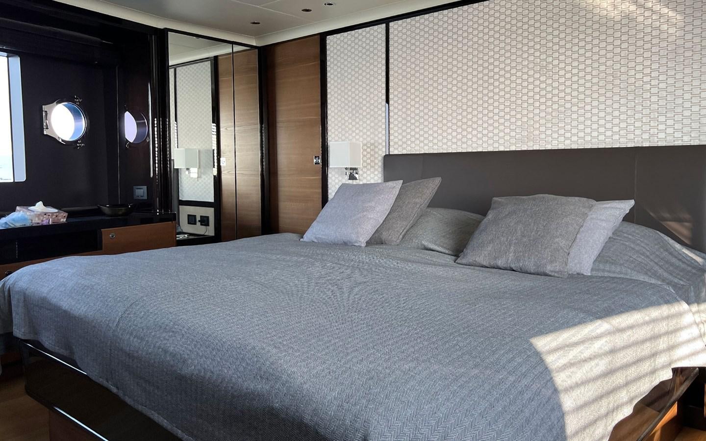 a bed with white sheets aboard A4A Yacht for Sale