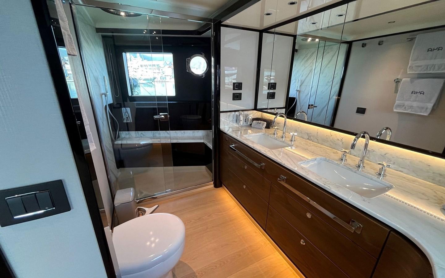 a bathroom with a large mirror aboard A4A Yacht for Sale