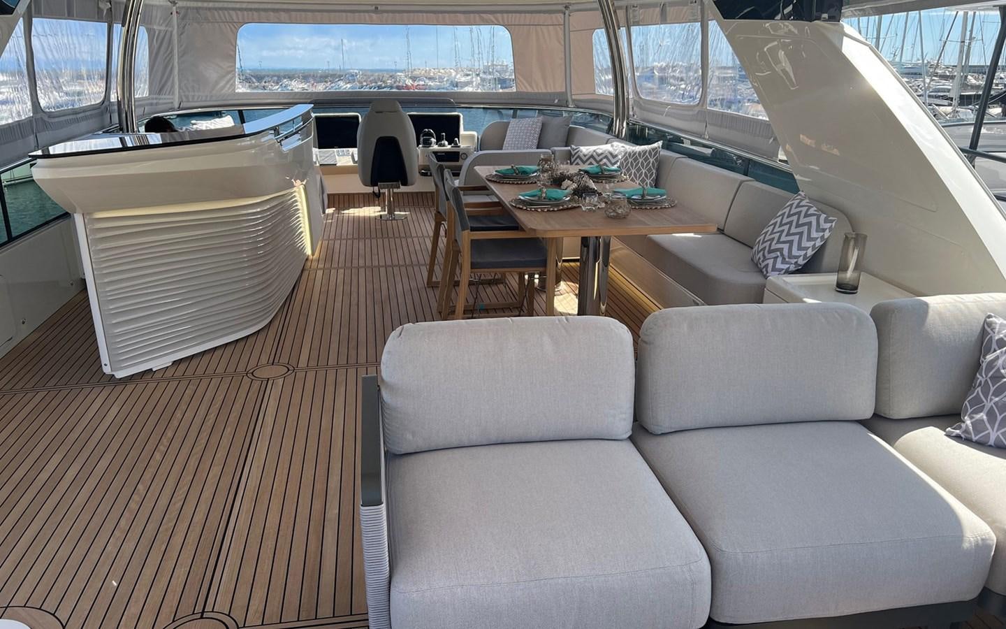 a room with a table and chairs aboard A4A Yacht for Sale