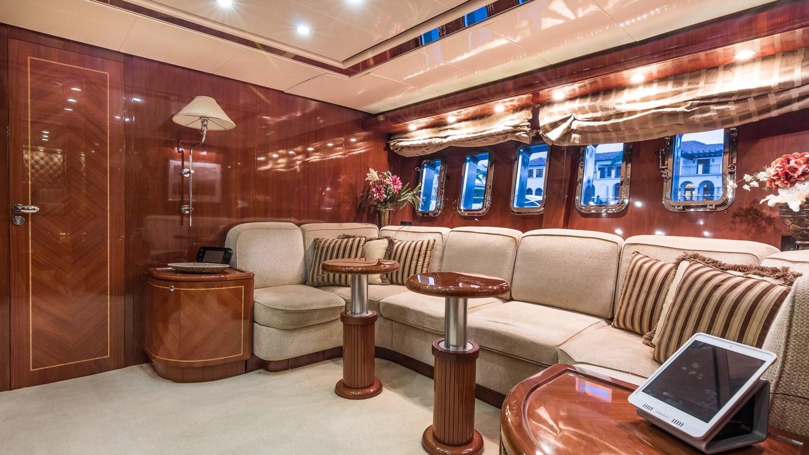 a room with a couch and a laptop aboard DOLCE VITA II Yacht for Sale