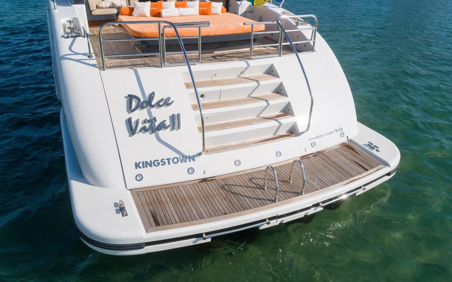 a white boat with blue lettering aboard DOLCE VITA II Yacht for Sale