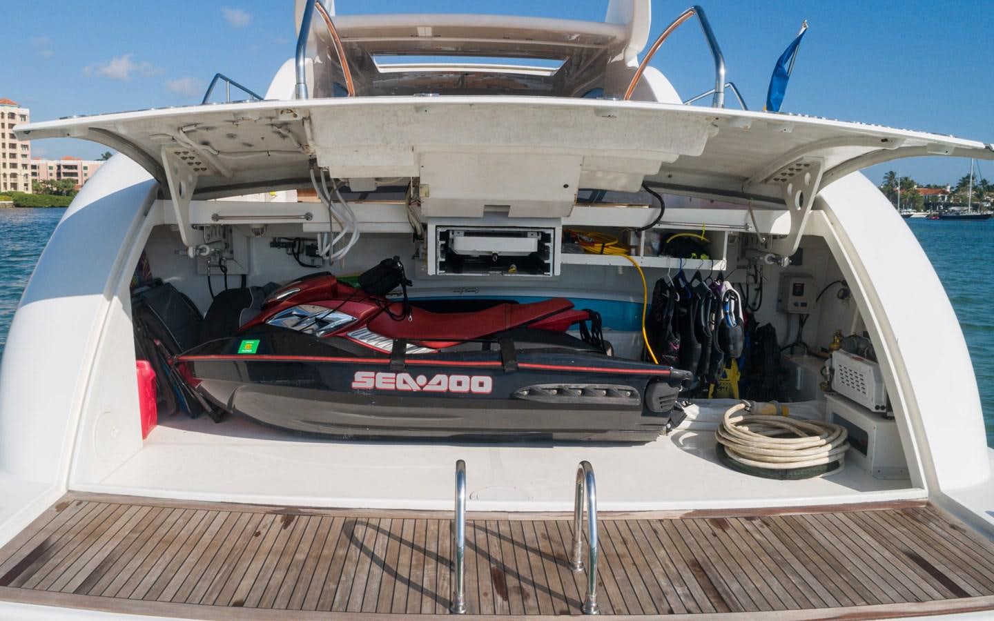 a boat with a red surfboard on the front aboard DOLCE VITA II Yacht for Sale