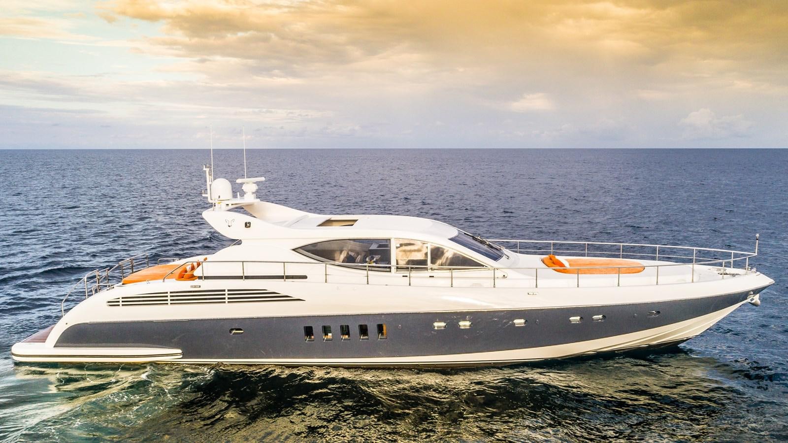 a white yacht on the beach aboard DOLCE VITA II Yacht for Sale