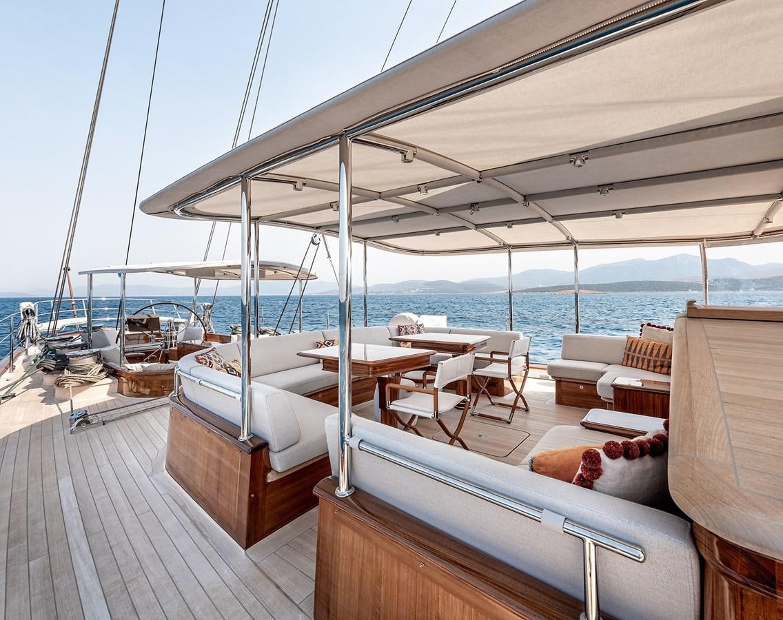 a deck with a view of the ocean and the ocean aboard GRACE III Yacht for Sale