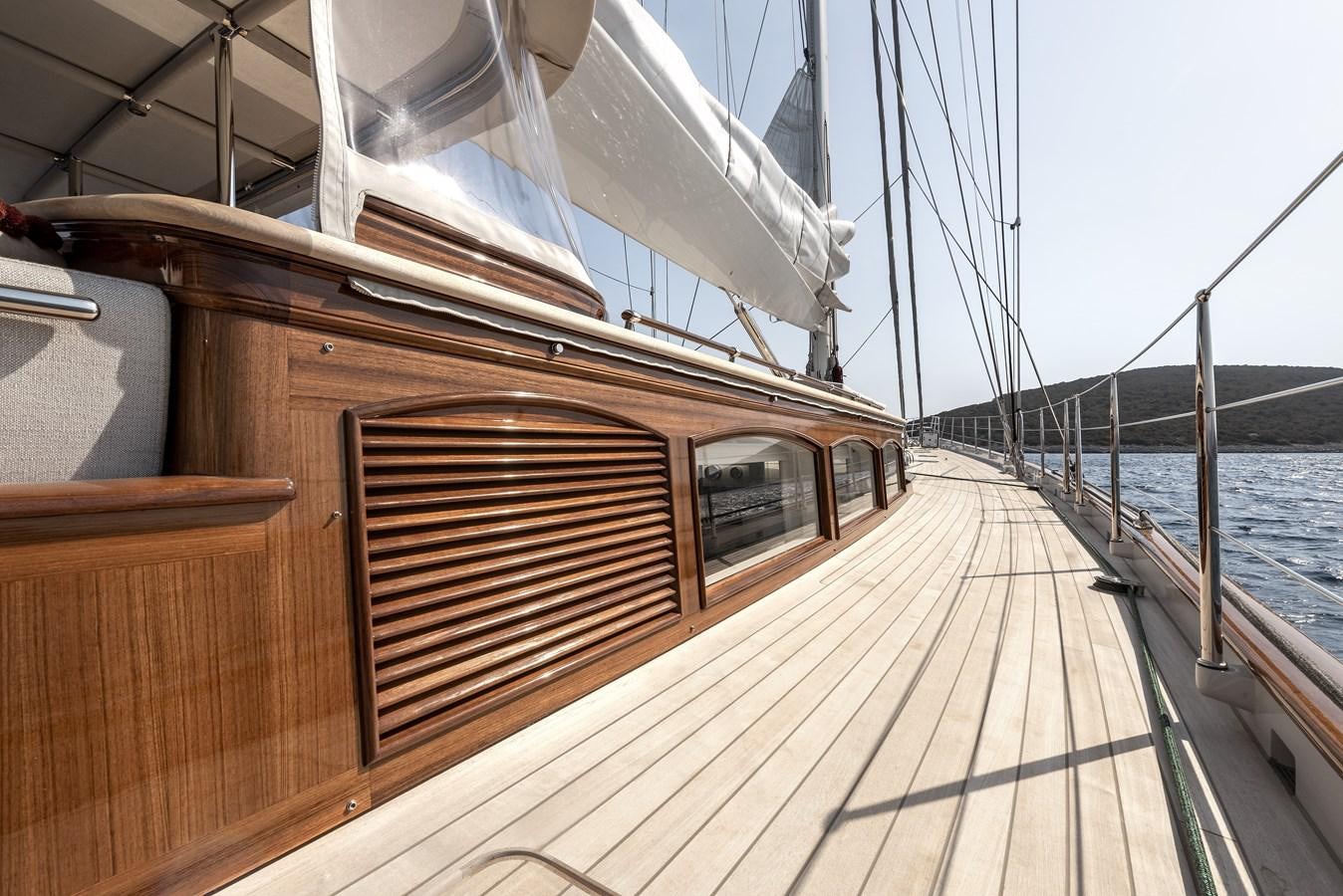 a wooden boat on a dock aboard GRACE III Yacht for Sale