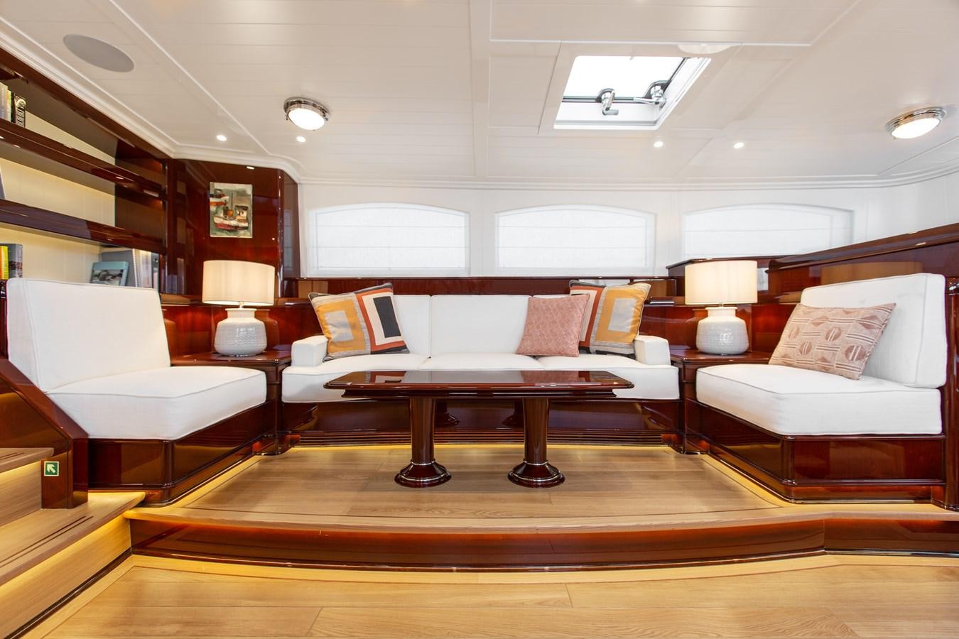 a room with a couch and a table aboard GRACE III Yacht for Sale