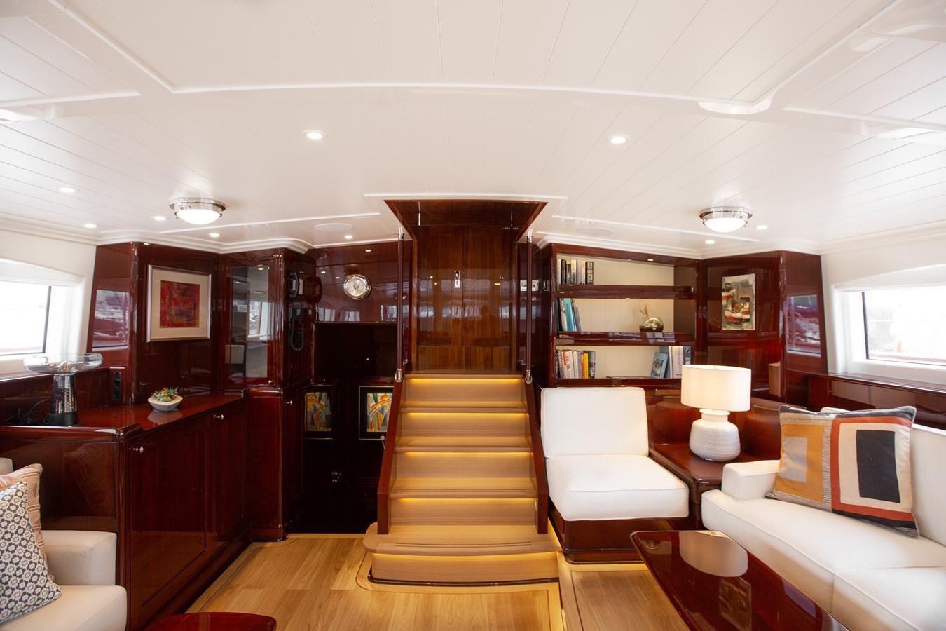 a living room with wood floors aboard GRACE III Yacht for Sale