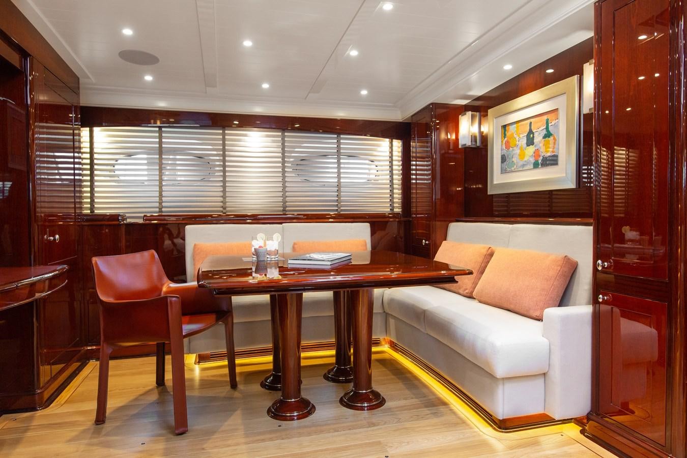 a living room with a couch and a table aboard GRACE III Yacht for Sale