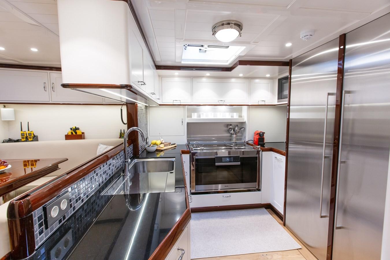 a kitchen with stainless steel appliances aboard GRACE III Yacht for Sale