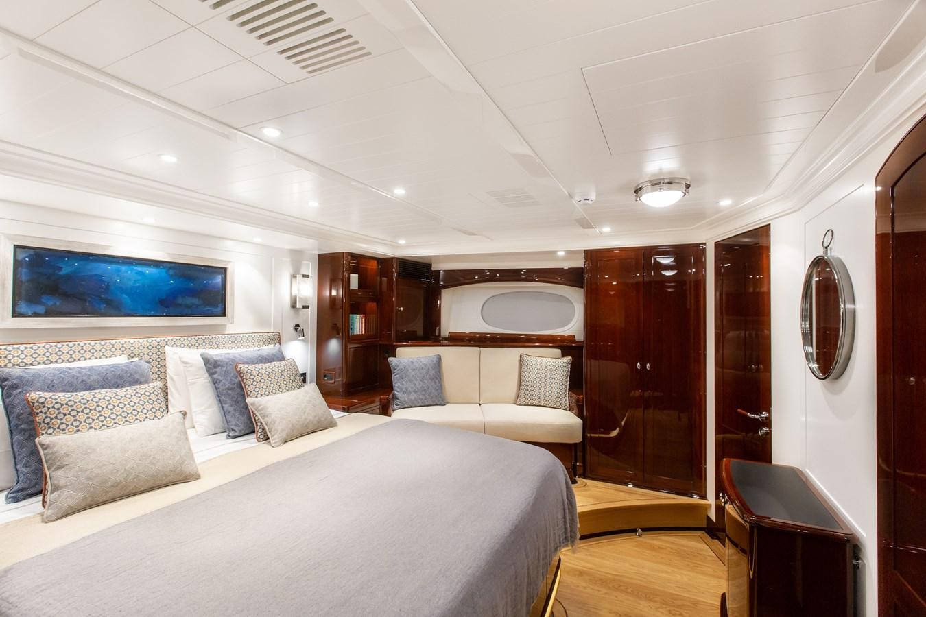 a room with a bed and a television aboard GRACE III Yacht for Sale