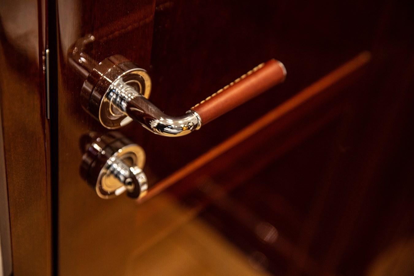a close-up of a door handle aboard GRACE III Yacht for Sale