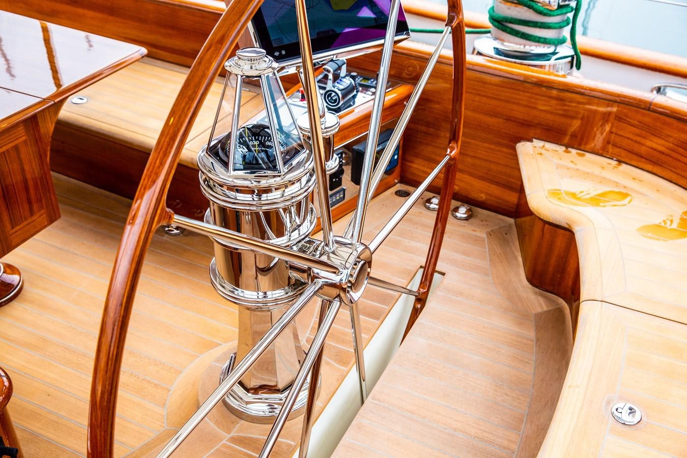 a metal object on a wooden surface aboard GRACE III Yacht for Sale