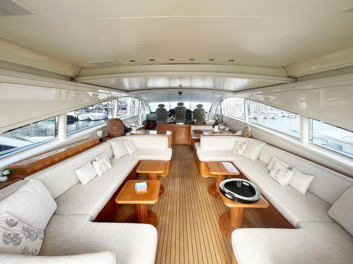 a living room with a large window aboard NAISCA IV Yacht for Sale