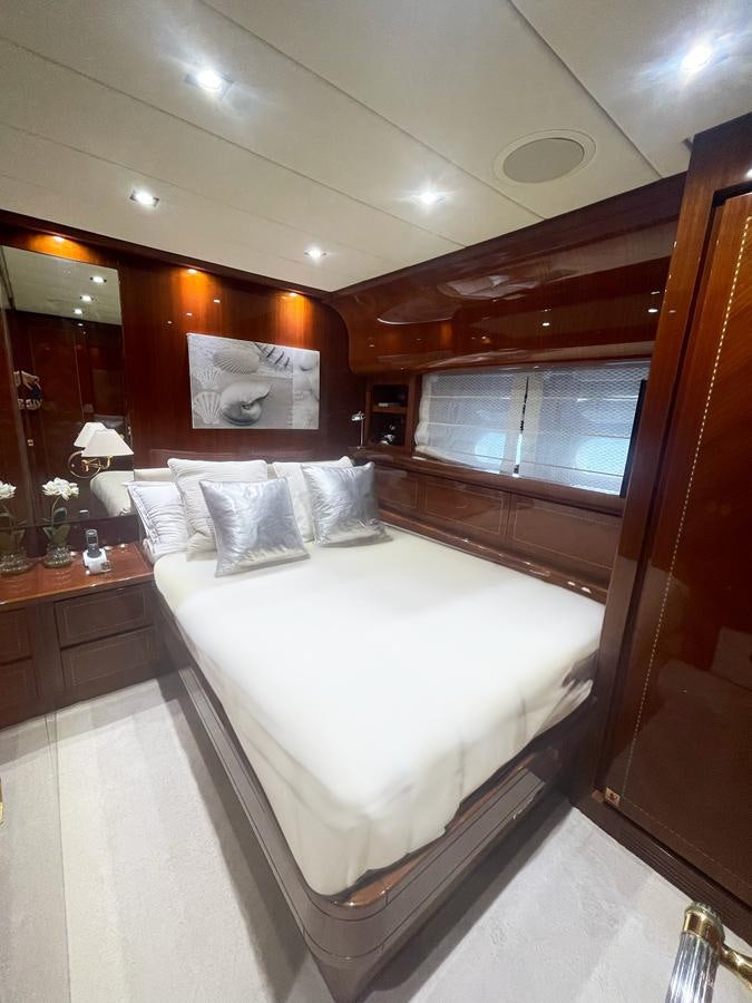 a bed in a room aboard NAISCA IV Yacht for Sale