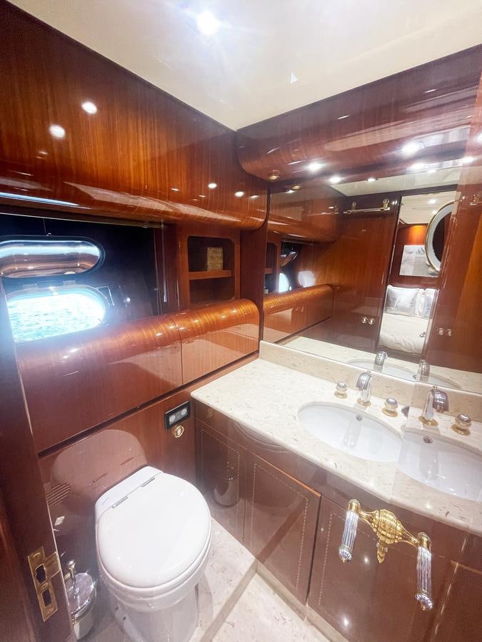 a bathroom with a sink and a toilet aboard NAISCA IV Yacht for Sale