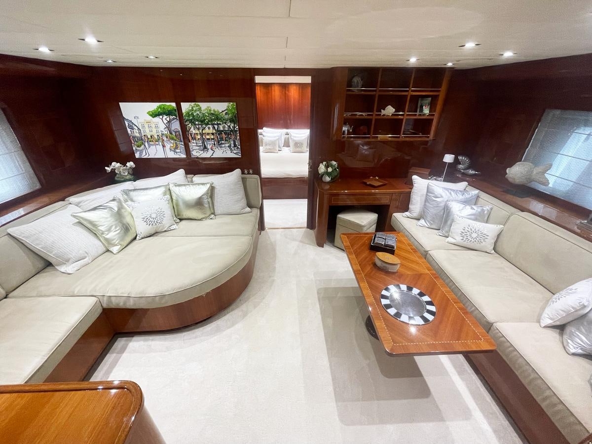 a room with a couch and a table aboard NAISCA IV Yacht for Sale