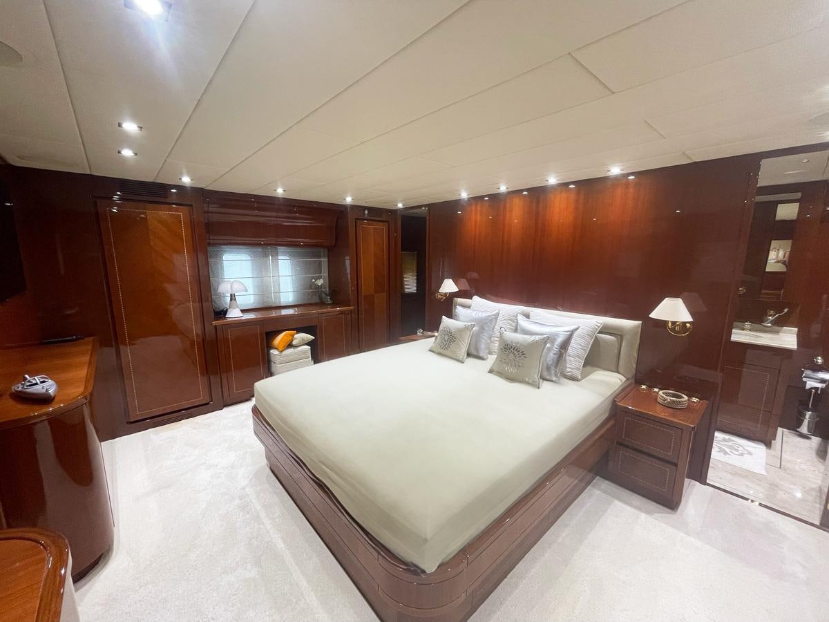 a hotel room with a bed aboard NAISCA IV Yacht for Sale