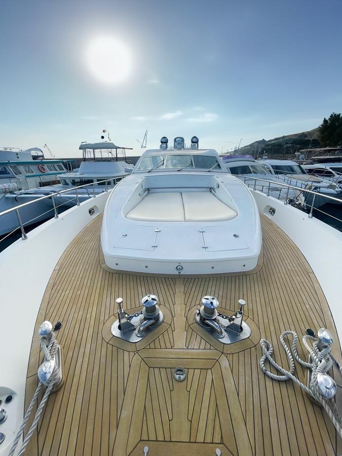a boat docked at a pier aboard NAISCA IV Yacht for Sale