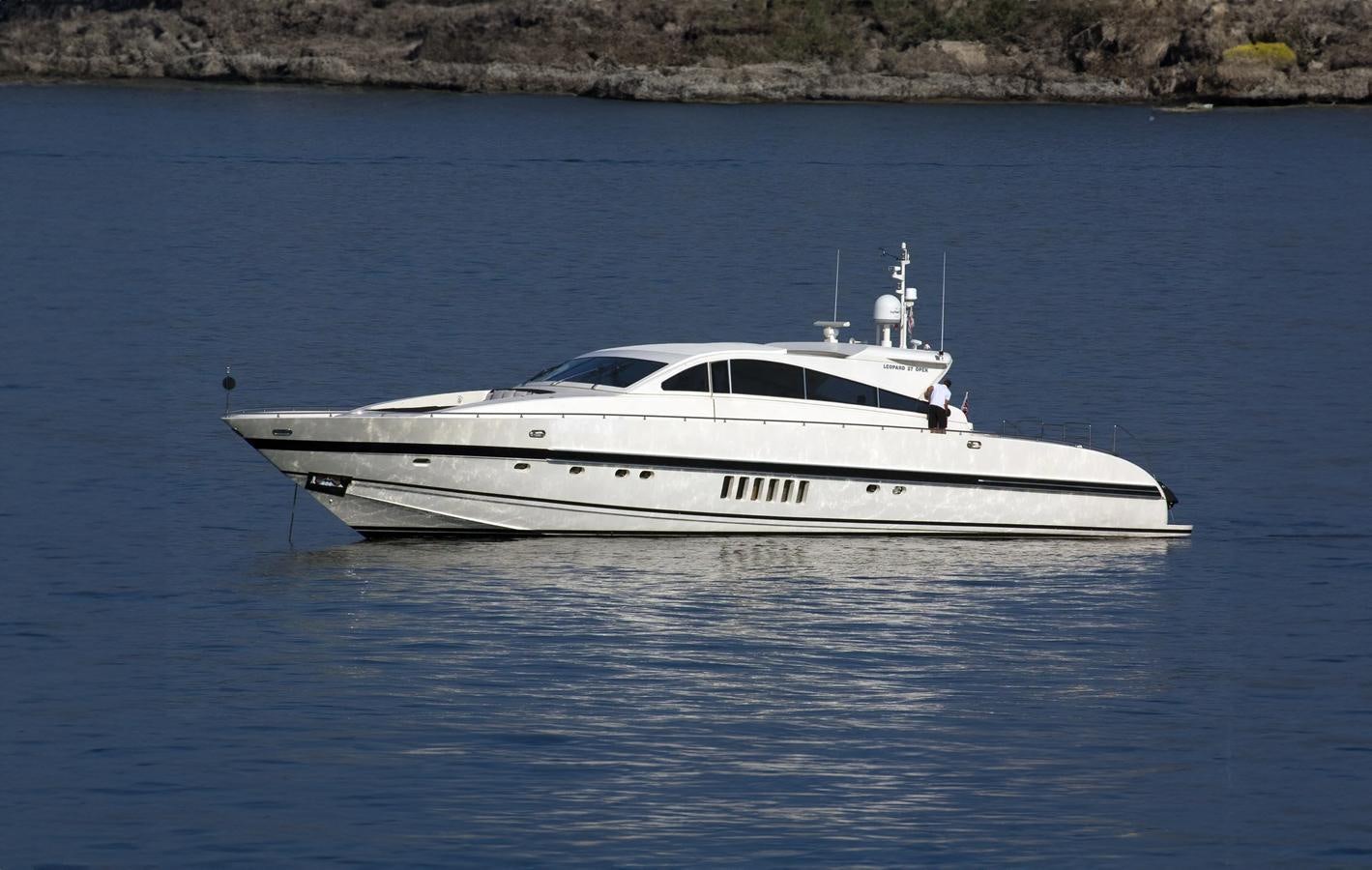 a white boat in the water aboard NAISCA IV Yacht for Sale