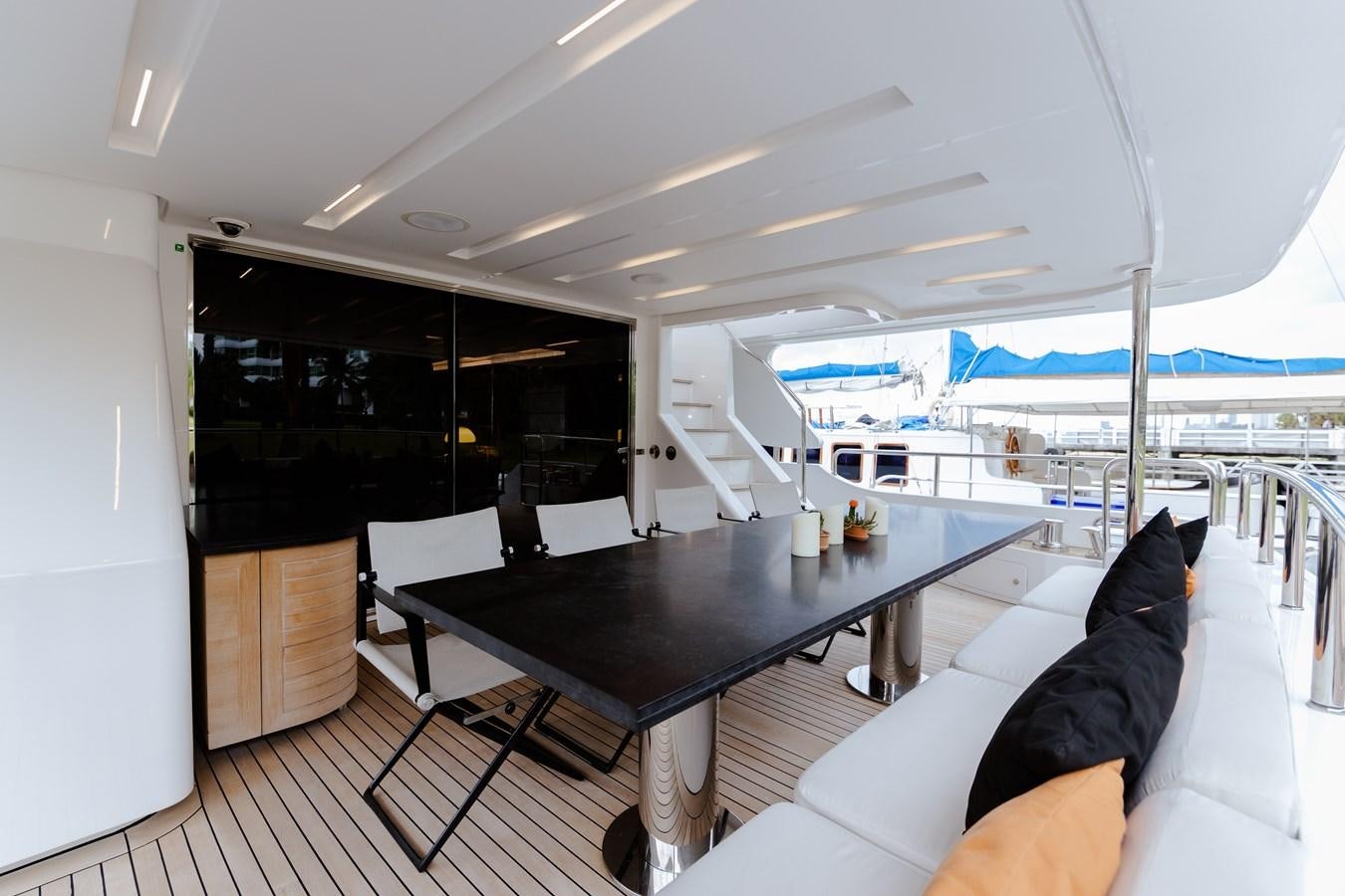 a table with chairs around it aboard LIBERTY CALL Yacht for Sale