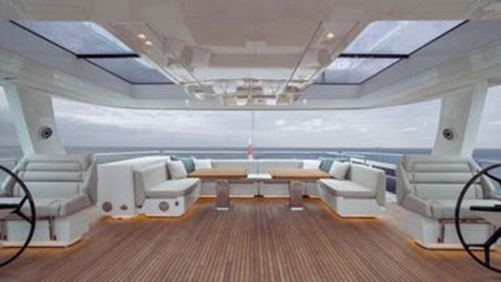 a room with a table and chairs aboard TRUE NORTH Yacht for Sale