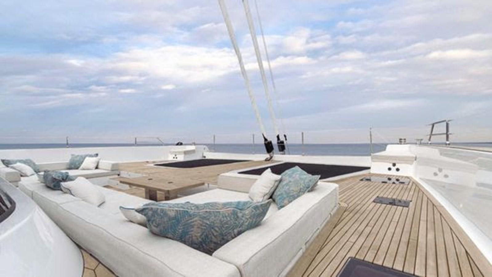 a rooftop with a large deck overlooking a body of water aboard TRUE NORTH Yacht for Sale
