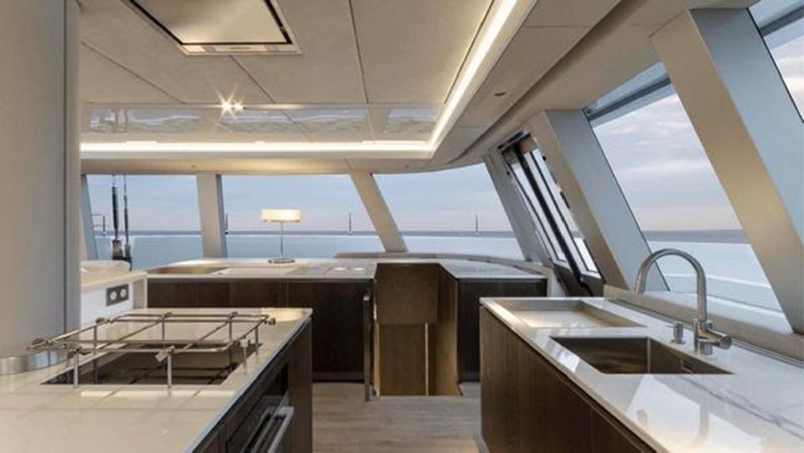 a room with a large window and a sink aboard TRUE NORTH Yacht for Sale