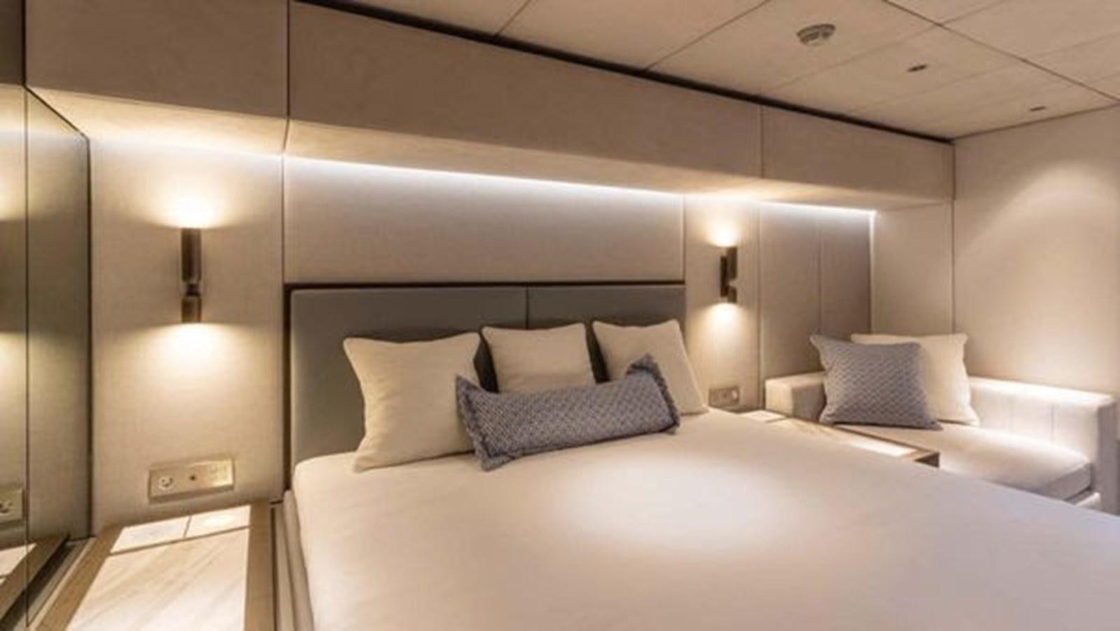 a bed with white sheets aboard TRUE NORTH Yacht for Sale