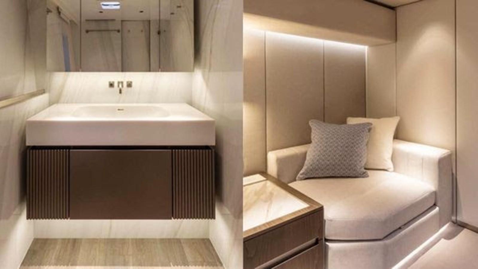 a bathroom with a sink and a bed aboard TRUE NORTH Yacht for Sale