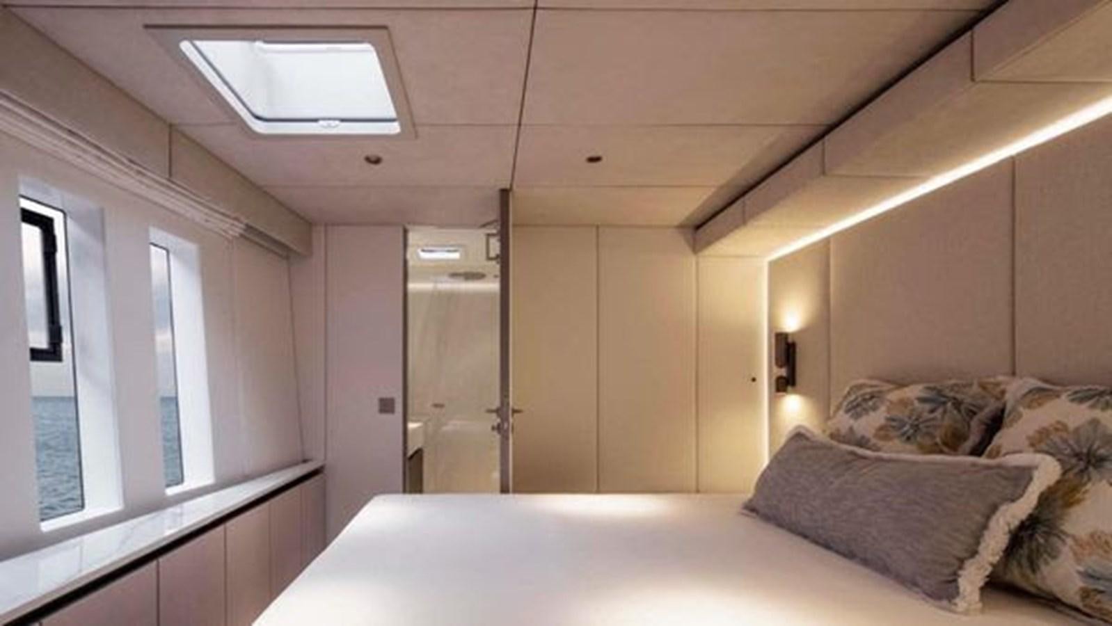 a bedroom with a bed and a door aboard TRUE NORTH Yacht for Sale