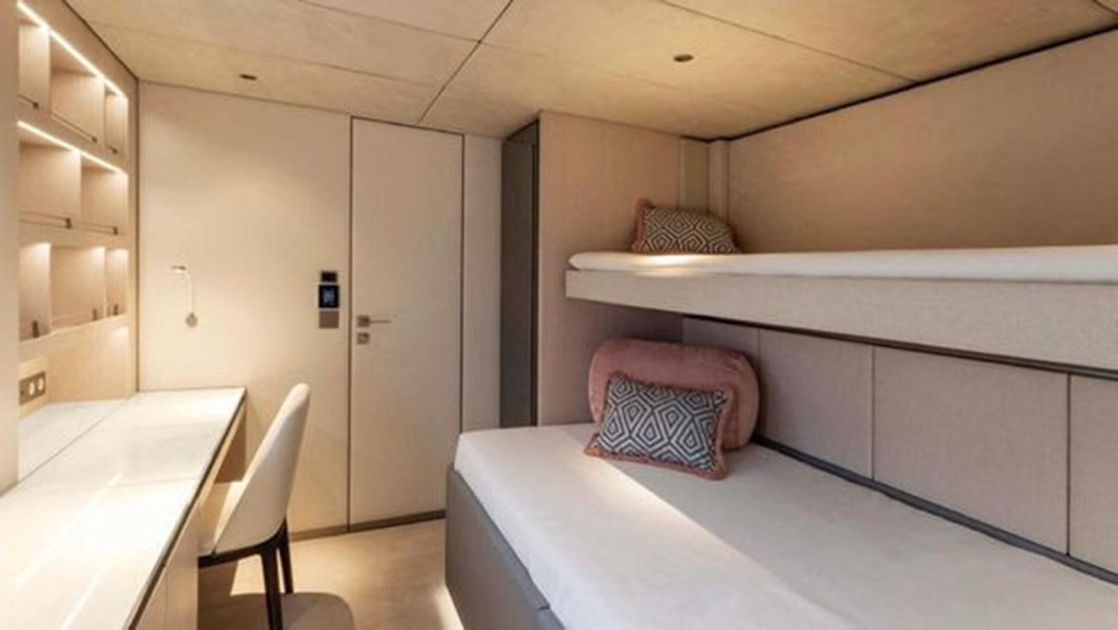 a room with a table and a bed aboard TRUE NORTH Yacht for Sale