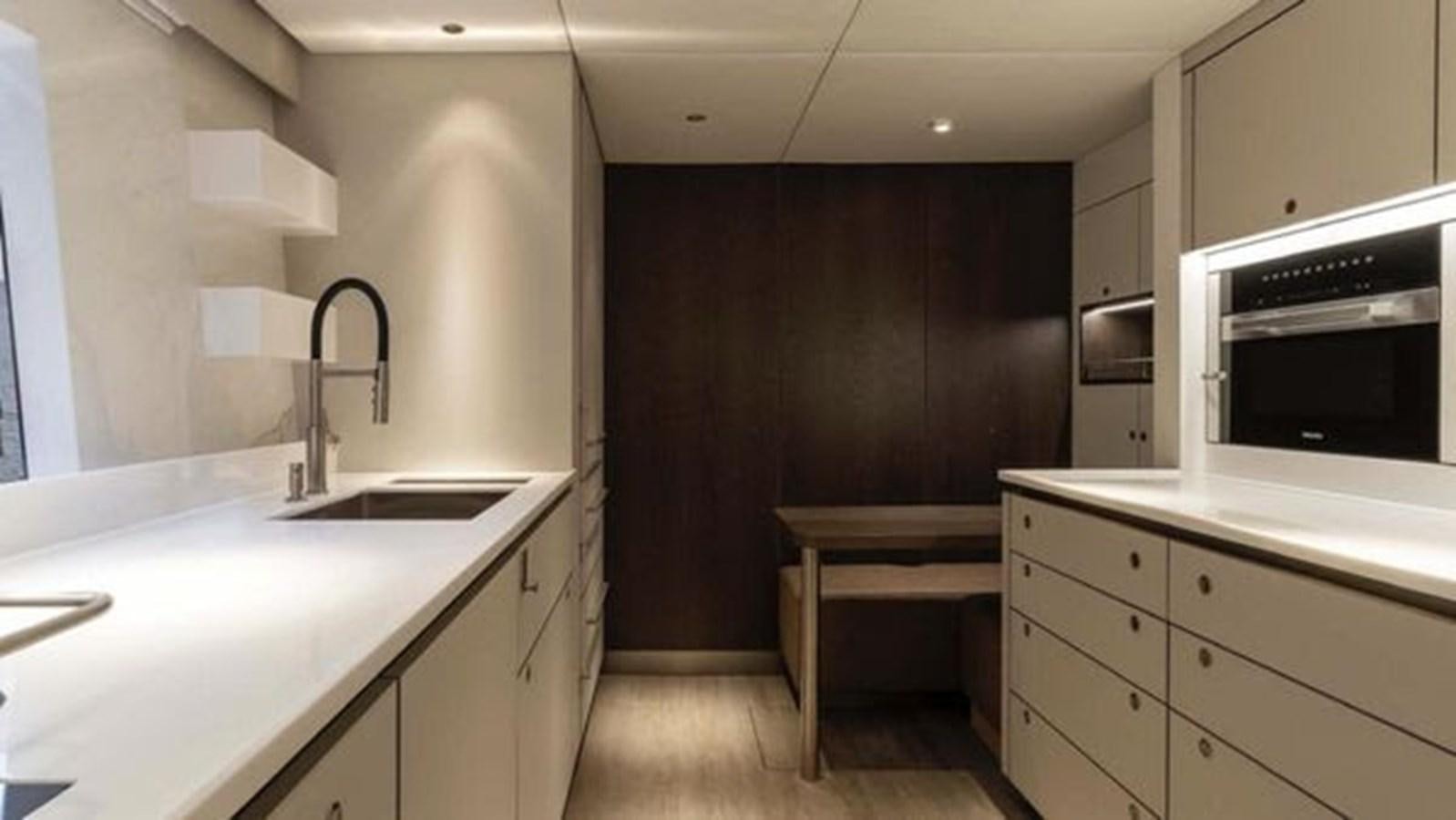 a kitchen with a sink and a microwave aboard TRUE NORTH Yacht for Sale