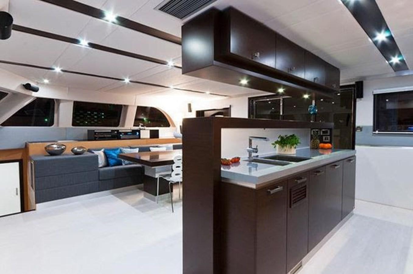 a kitchen with a large island aboard 2012 SUNREEF C Yacht for Sale
