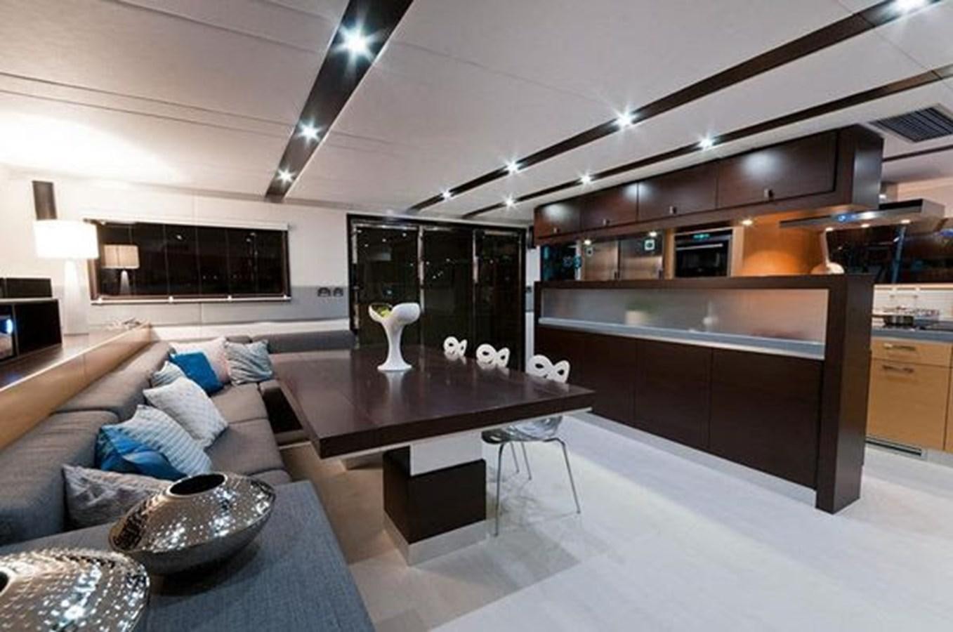 a living room with a couch and a coffee table aboard 2012 SUNREEF C Yacht for Sale