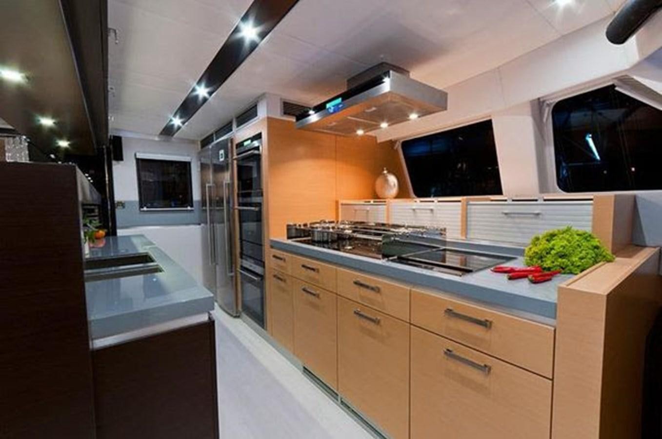 a kitchen with a large island aboard 2012 SUNREEF C Yacht for Sale