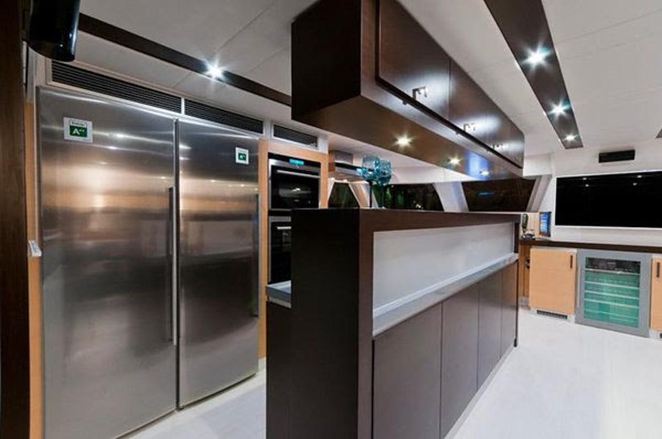 a large kitchen with stainless steel appliances aboard 2012 SUNREEF C Yacht for Sale