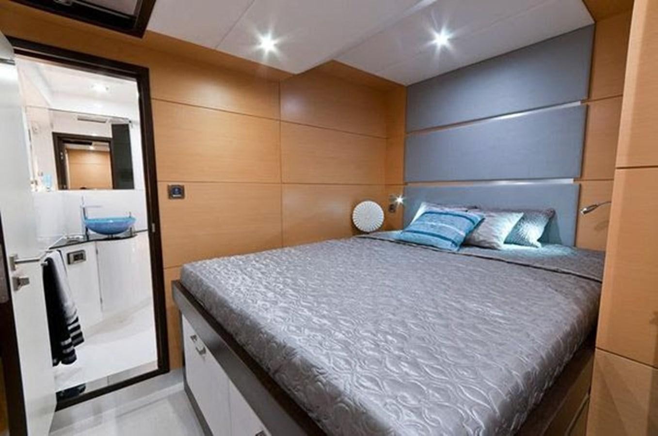 a bed in a room aboard 2012 SUNREEF C Yacht for Sale