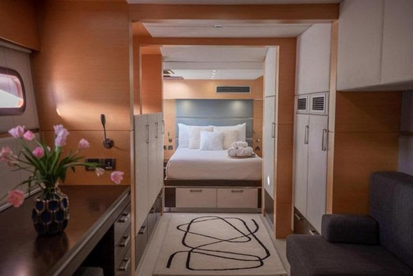 a bedroom with a bed and a desk aboard 2012 SUNREEF C Yacht for Sale