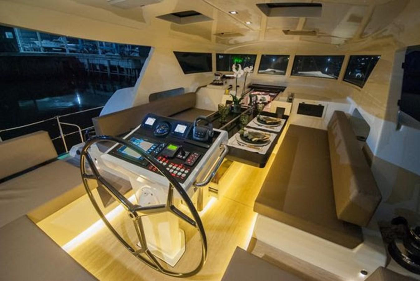 a room with a table and chairs aboard 2024 MCP GLOBAL EXP 68 Yacht for Sale