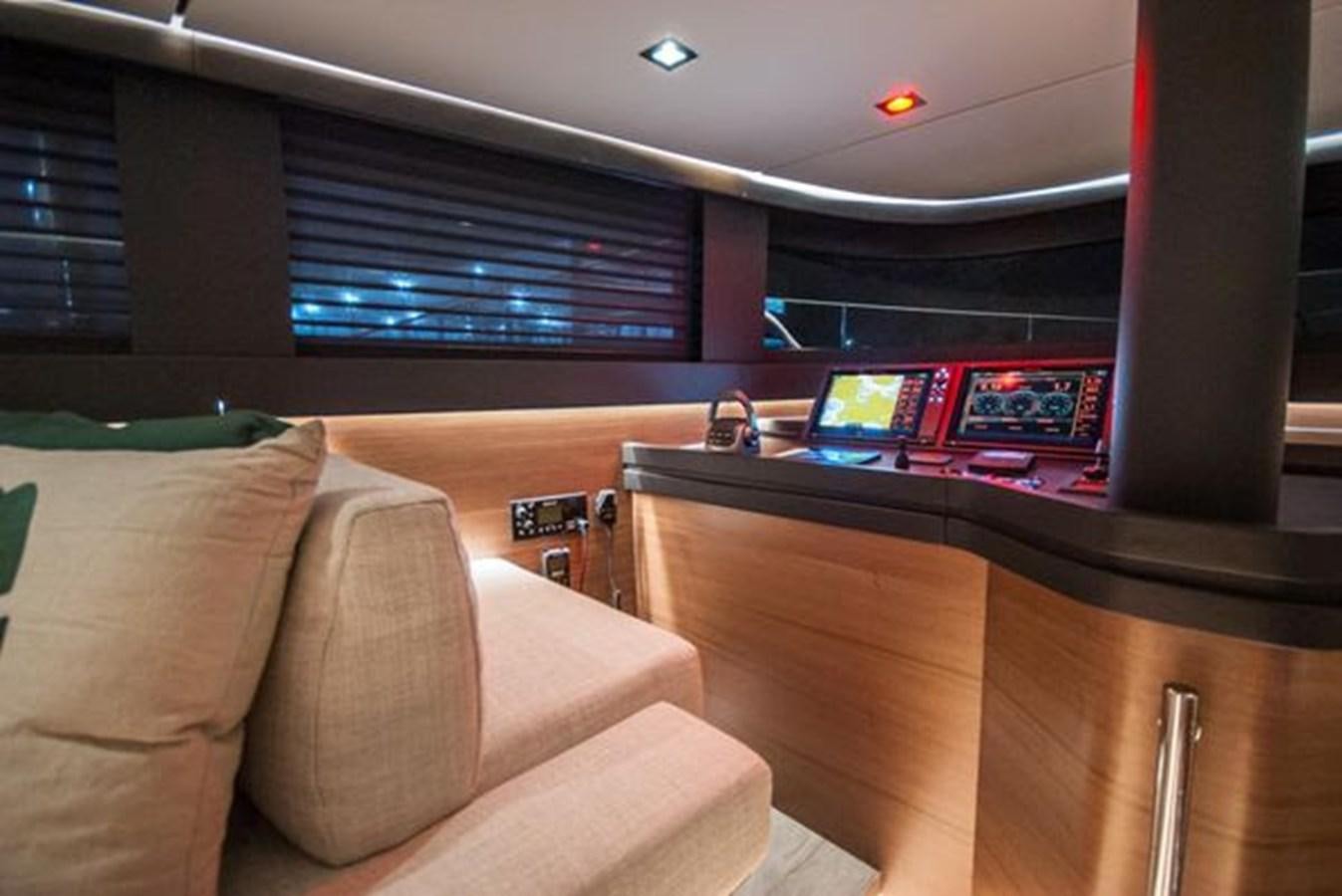 a room with a couch and a desk with a computer on it aboard 2024 MCP GLOBAL EXP 68 Yacht for Sale