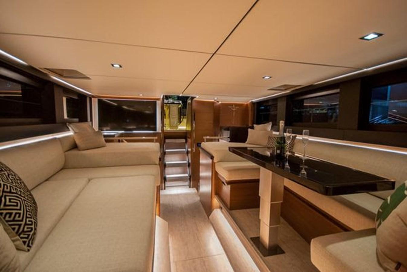 a living room with a large sofa aboard 2024 MCP GLOBAL EXP 68 Yacht for Sale