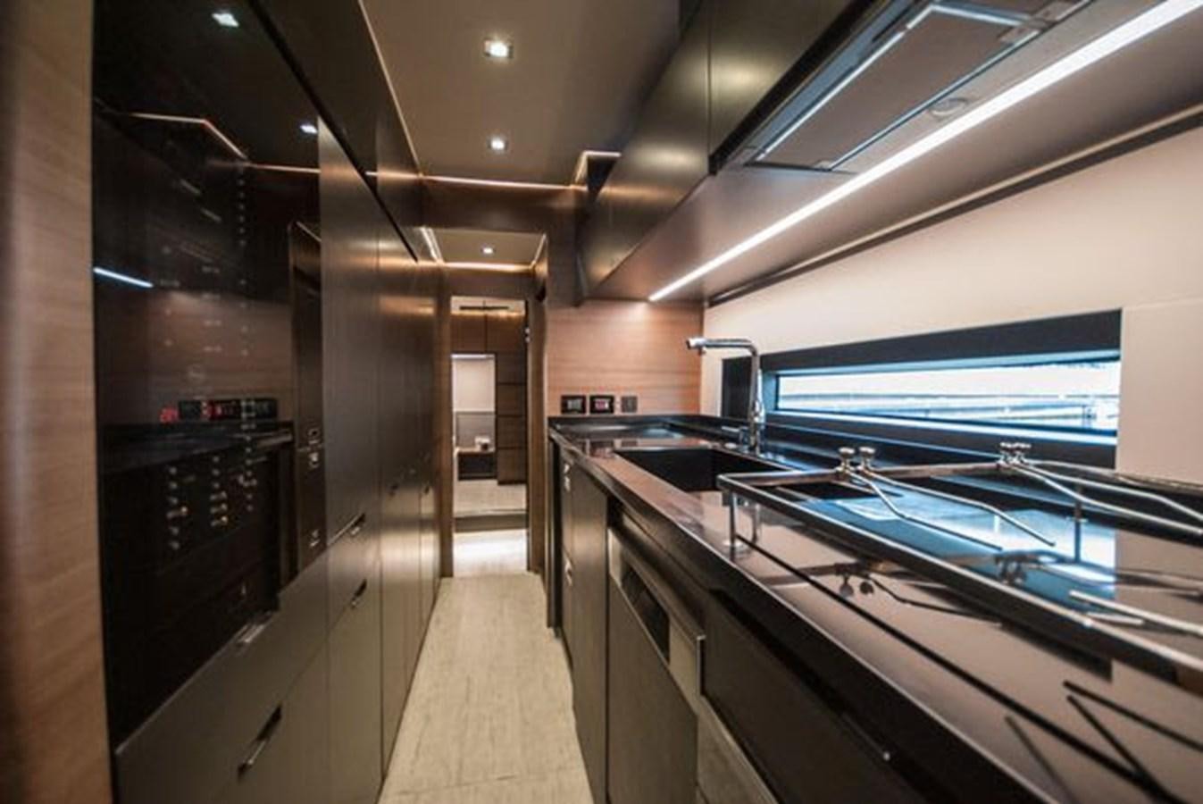 a large kitchen with a large window aboard 2024 MCP GLOBAL EXP 68 Yacht for Sale