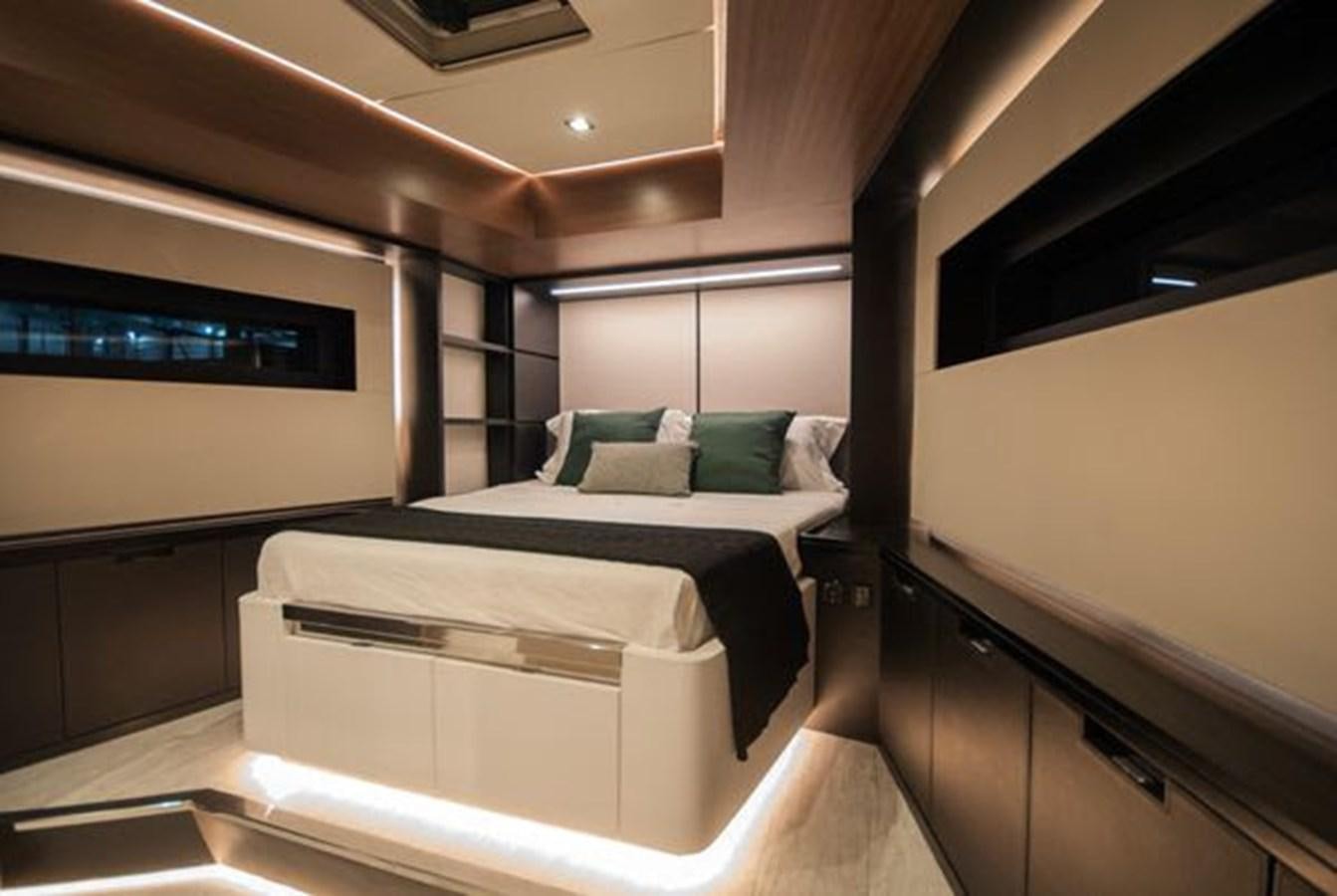 a room with a bed and a desk aboard 2024 MCP GLOBAL EXP 68 Yacht for Sale