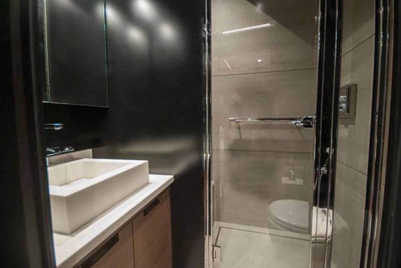 a bathroom with a glass shower aboard 2024 MCP GLOBAL EXP 68 Yacht for Sale