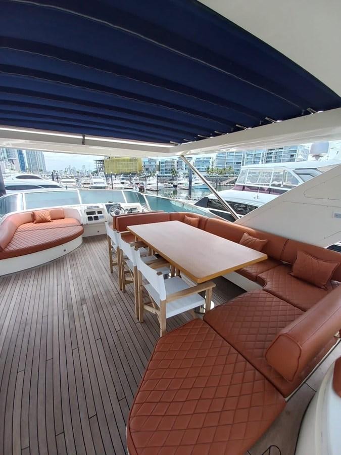 a deck with a view of the water and boats aboard M&M Yacht for Sale