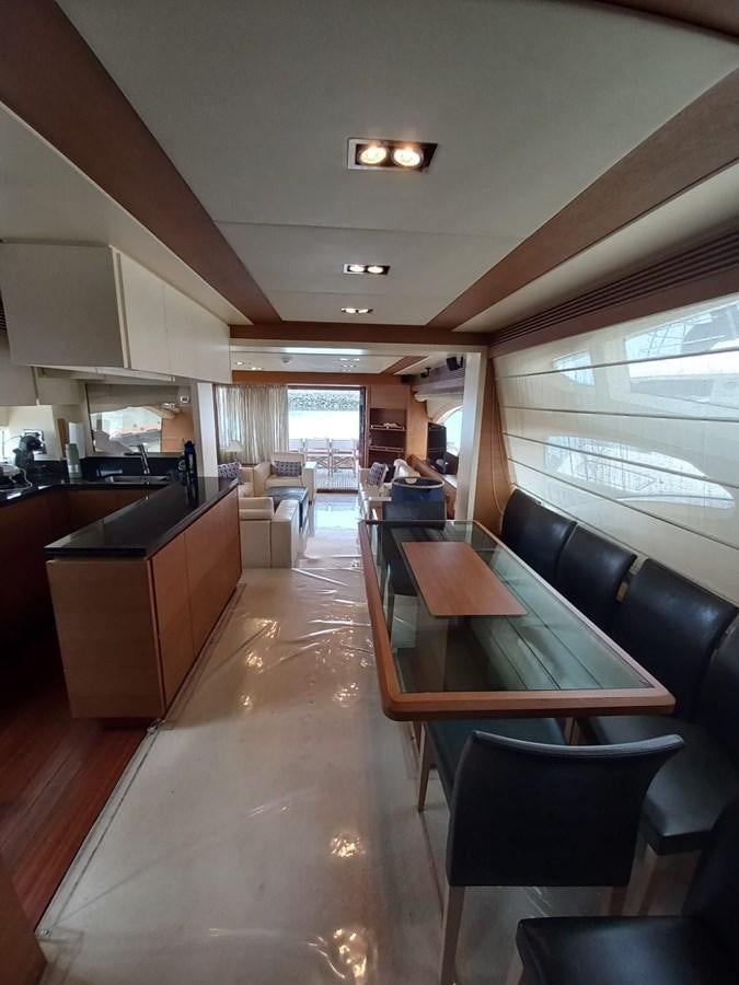 a large kitchen and dining area aboard M&M Yacht for Sale